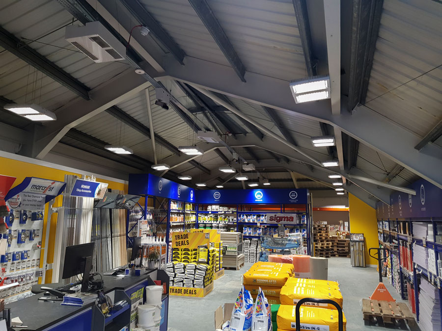Multiple XS-30 heaters suspended from the ceiling providing warmth to a DIY store