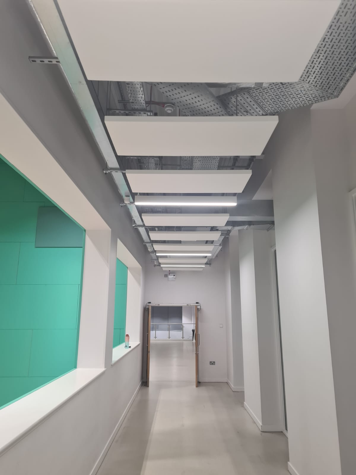 300W panels integrated into a suspended ceiling grid